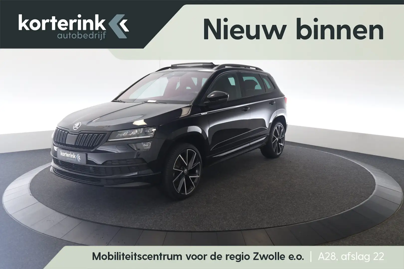 Skoda Karoq 1.5 TSI ACT Sportline Business | Trekhaak | Pano | Zwart - 1
