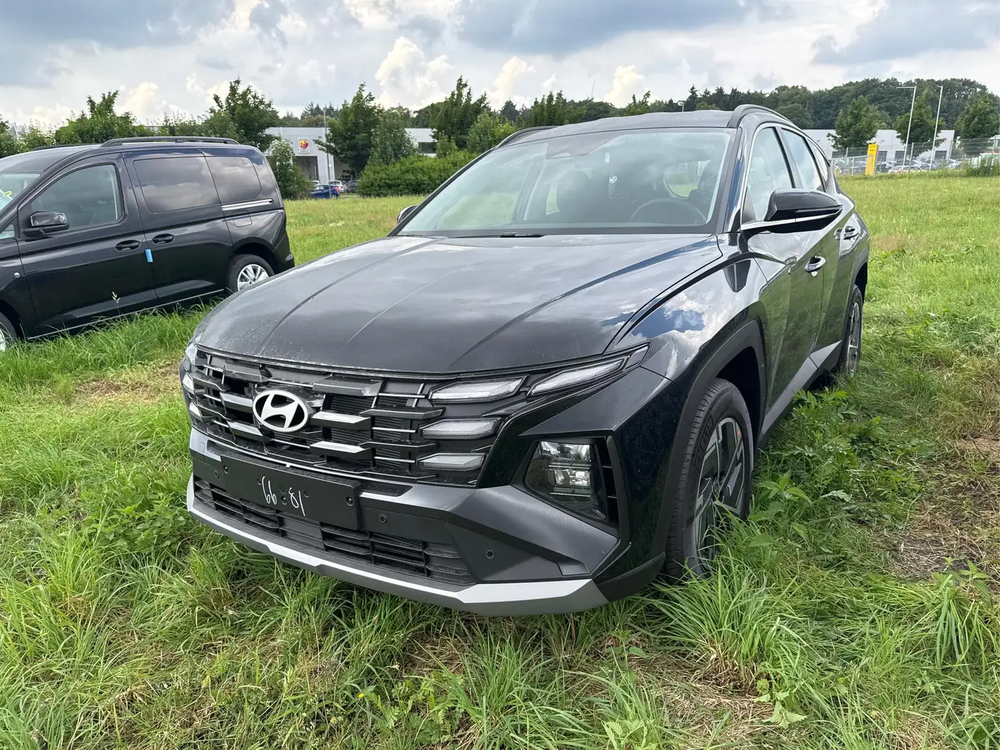 Hyundai TUCSON Style NAVI+KAMERA+SHZ+LED+TEMPOMAT+17" ALU+PDC ... Schwarz - 1