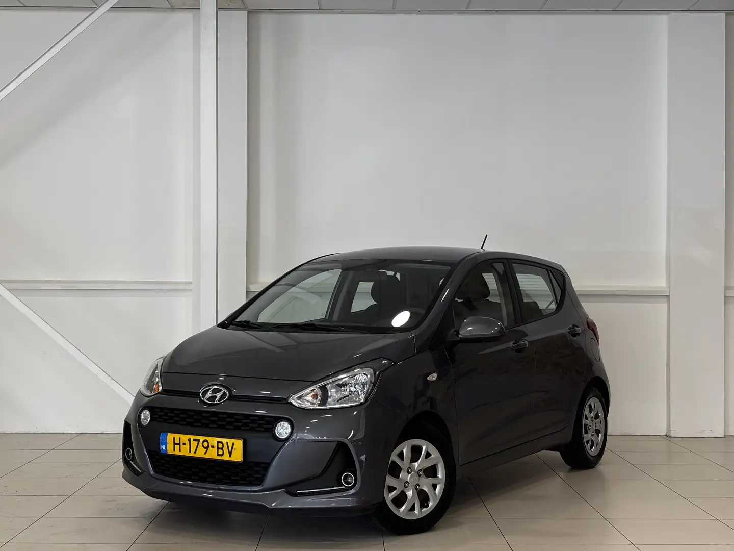 Hyundai i10 1.0i Comfort 5-drs | Airco | Cruise | Bluetooth | Gris - 1