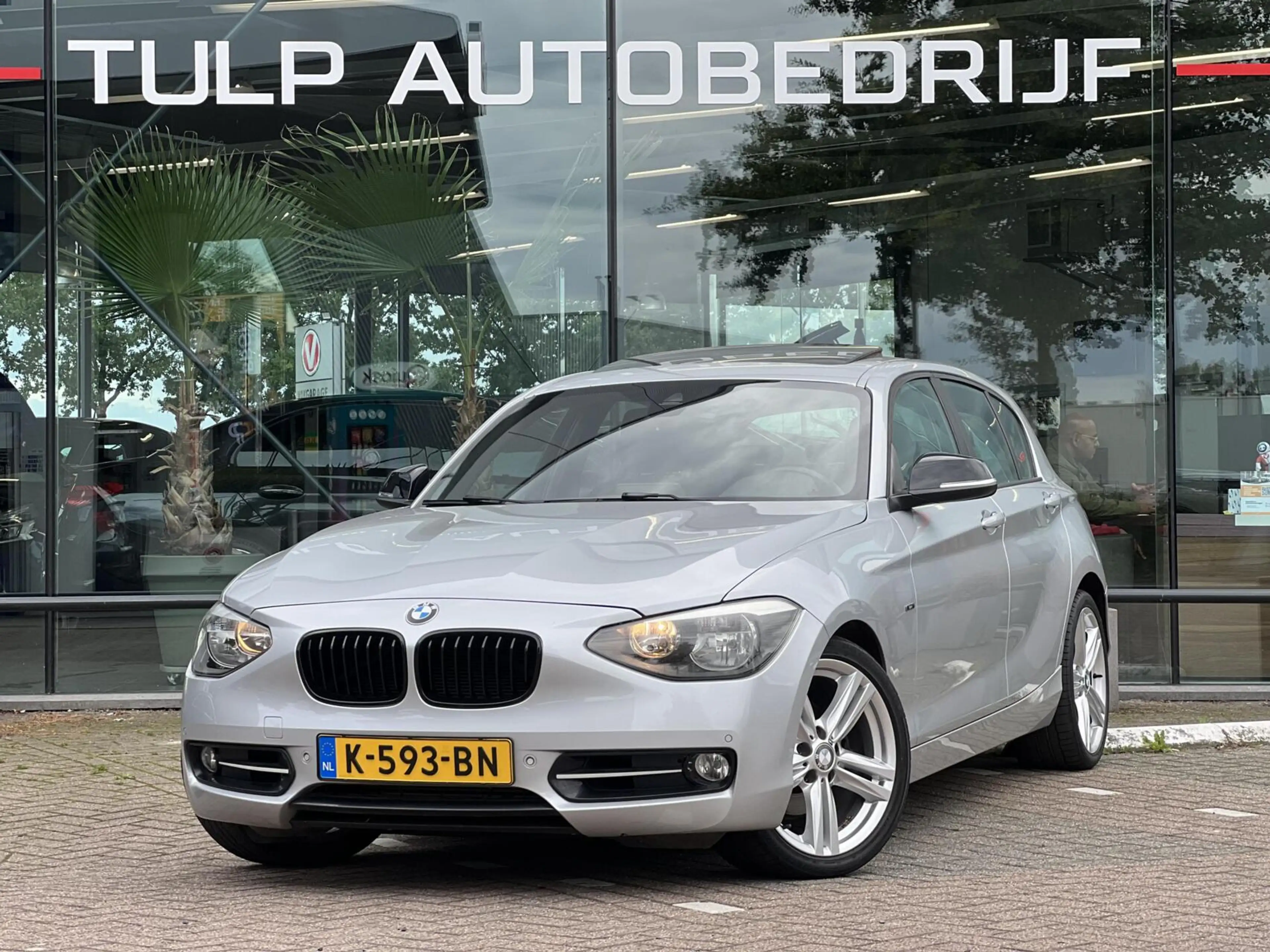 BMW 118 1-serie 118i Sport Line Airco Cruise Navi Open dak