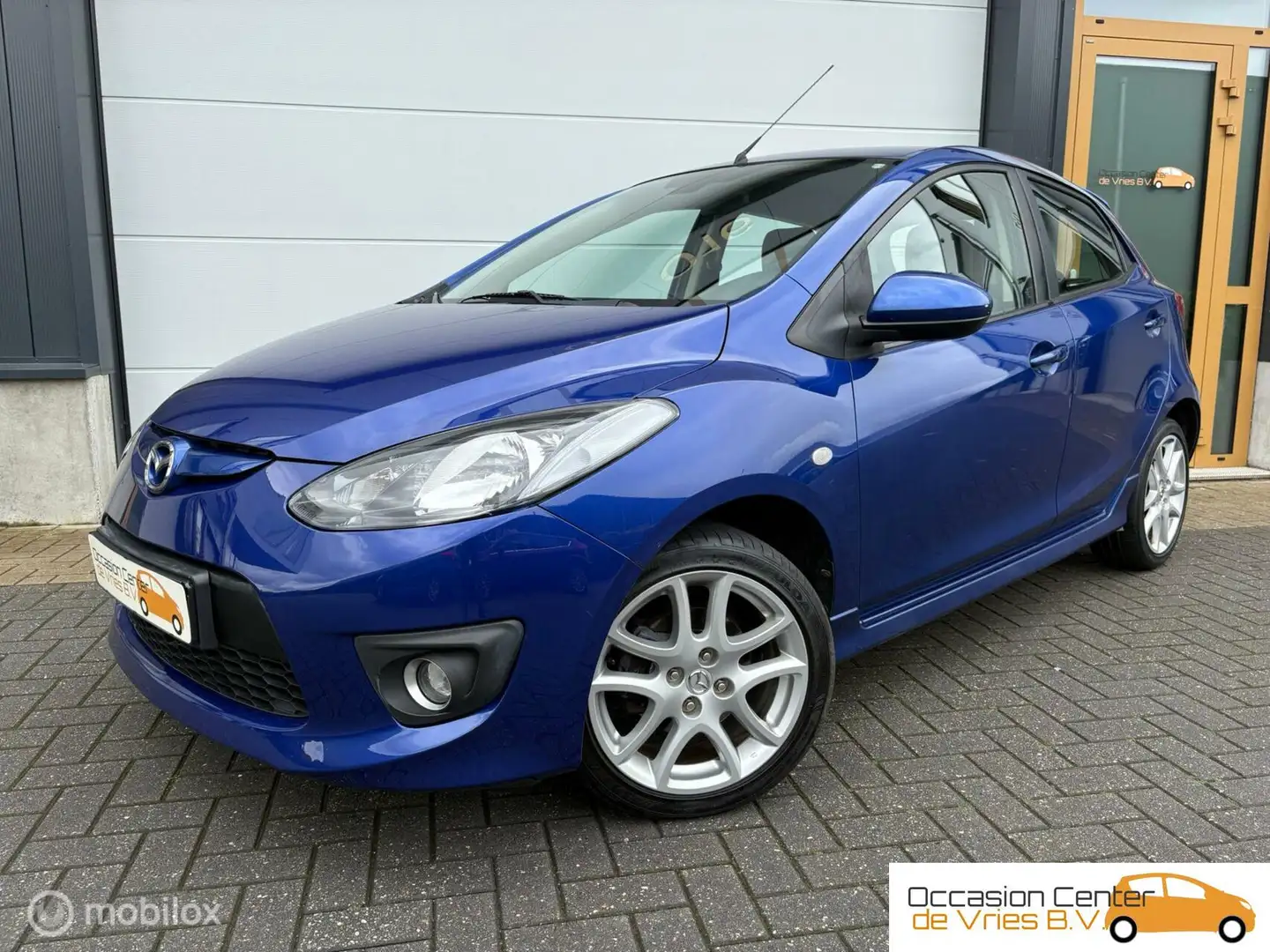 Mazda 2 1.5 GT-L 5DrsAircoCruiseVelgenStoelverwarmdBluetoo Синій - 1