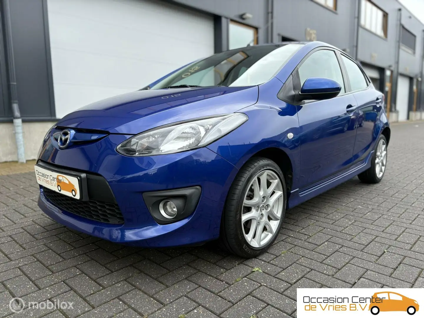 Mazda 2 1.5 GT-L 5DrsAircoCruiseVelgenStoelverwarmdBluetoo Синій - 2