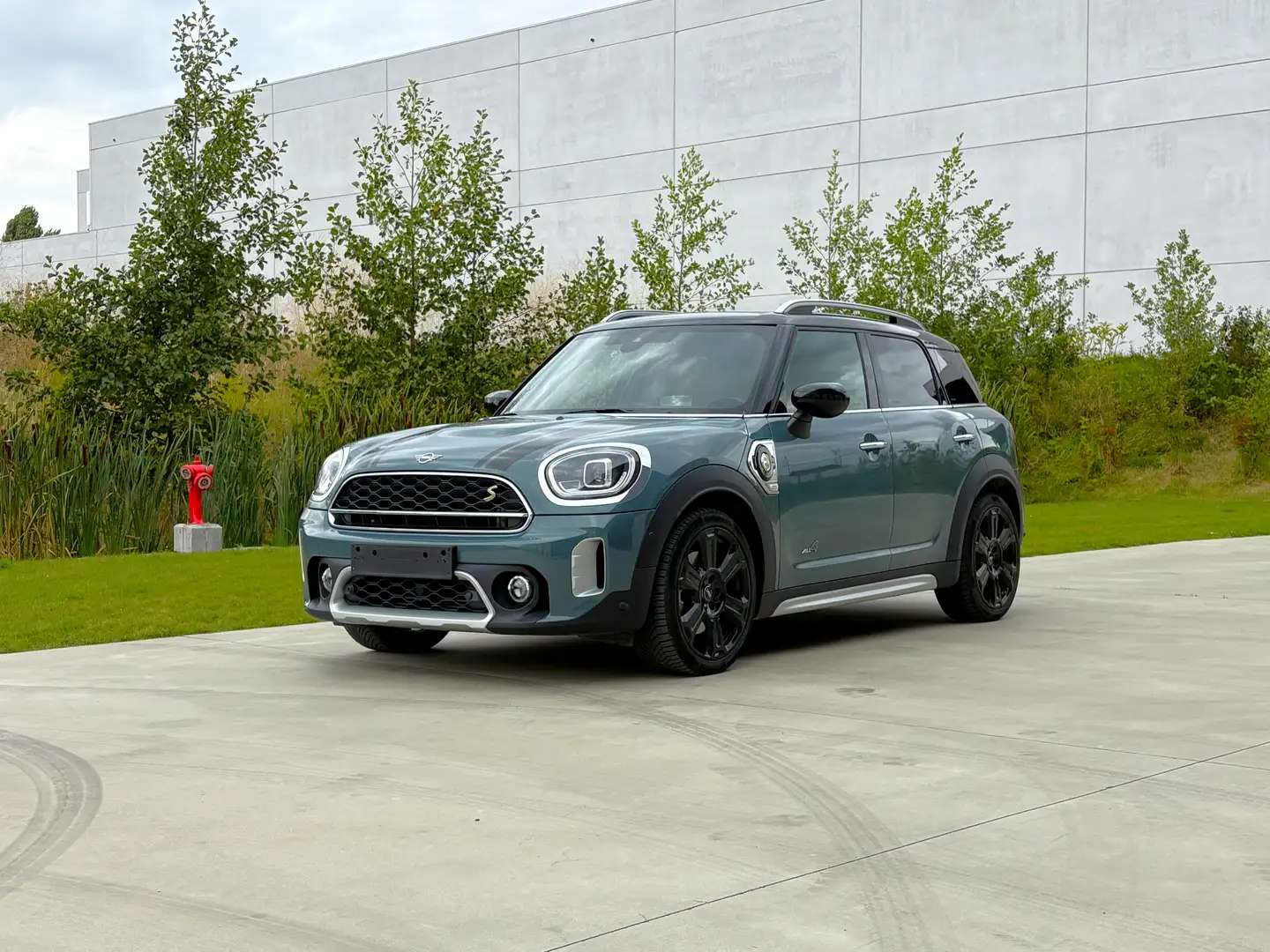 MINI Cooper SE Countryman All4 pano 19"JCW premium pakket Northwood Edition Groen - 1