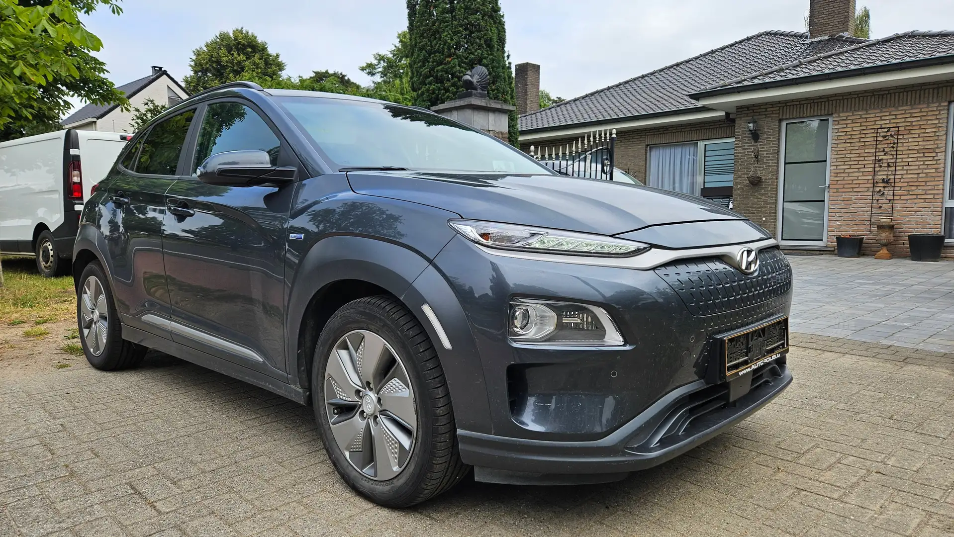 Hyundai KONA Kona EV Premium*LEATHER*HEAD UP*BLISS*NET 14500e Grijs - 1