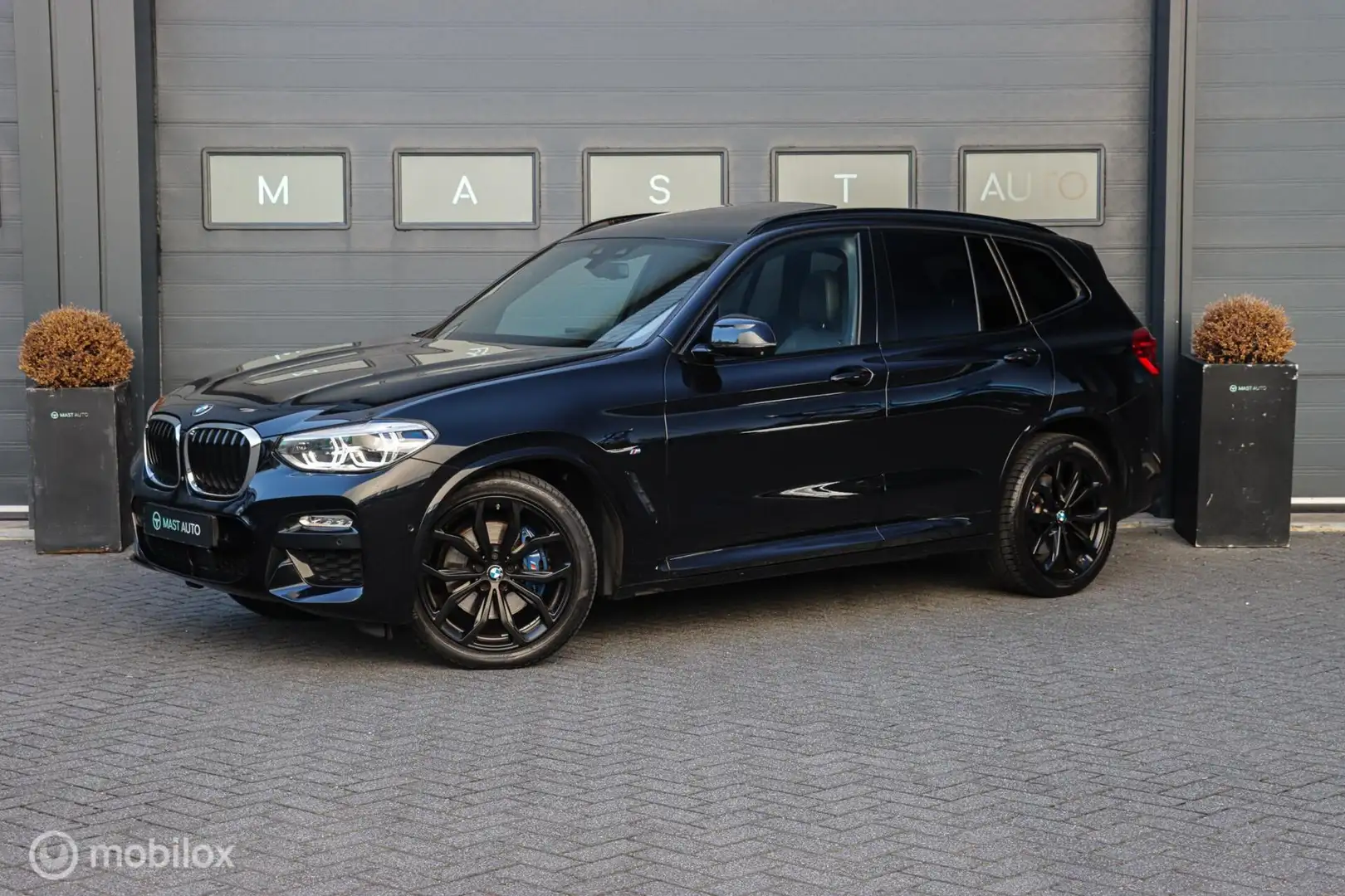 BMW X3 xDrive20i High Executive | M-sport | PANO | HUD | Zwart - 1
