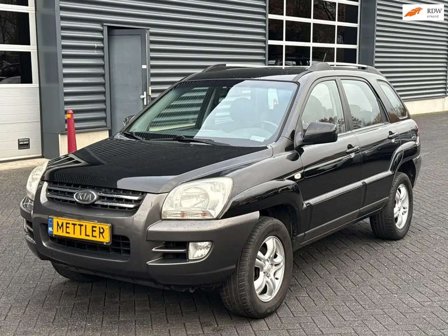 Kia Sportage 2.0 CVVT Executive, airco, trekhaak Zwart - 1