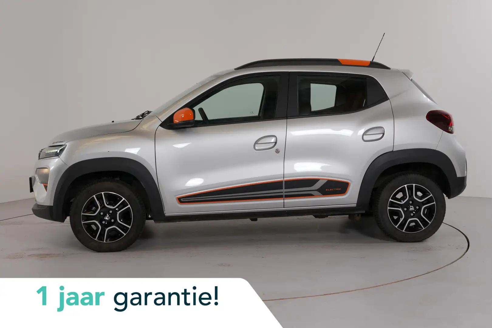 Dacia Spring 27 kWh Orange pack | Camera | Navi | Cruise | Airc Grijs - 1