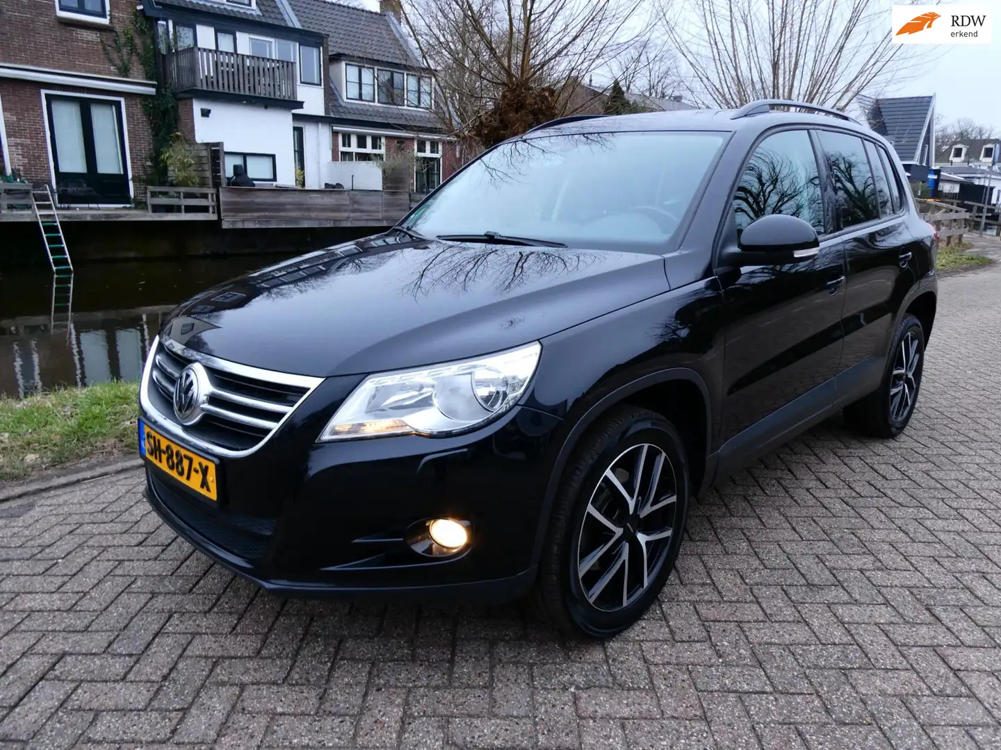 Volkswagen Tiguan 1.4 TSI Easyline 122pk Clima Cruise Navi Trekhaak Schwarz - 1
