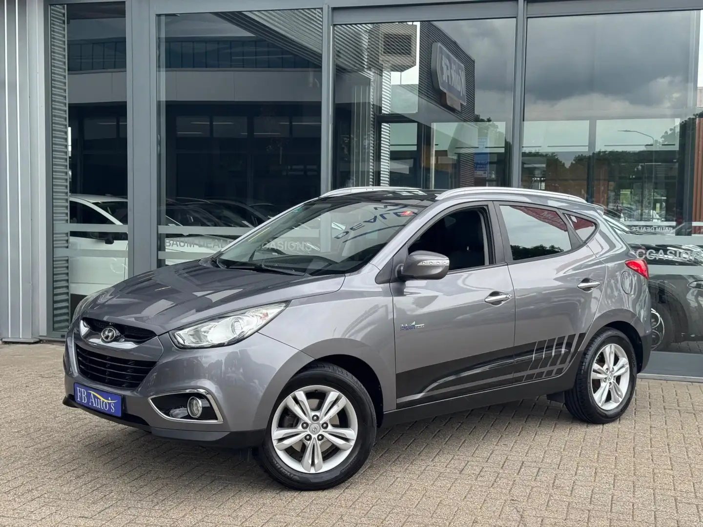 Hyundai iX35 1.6i GDI i-Light Airco Lmv Pano Grijs - 1