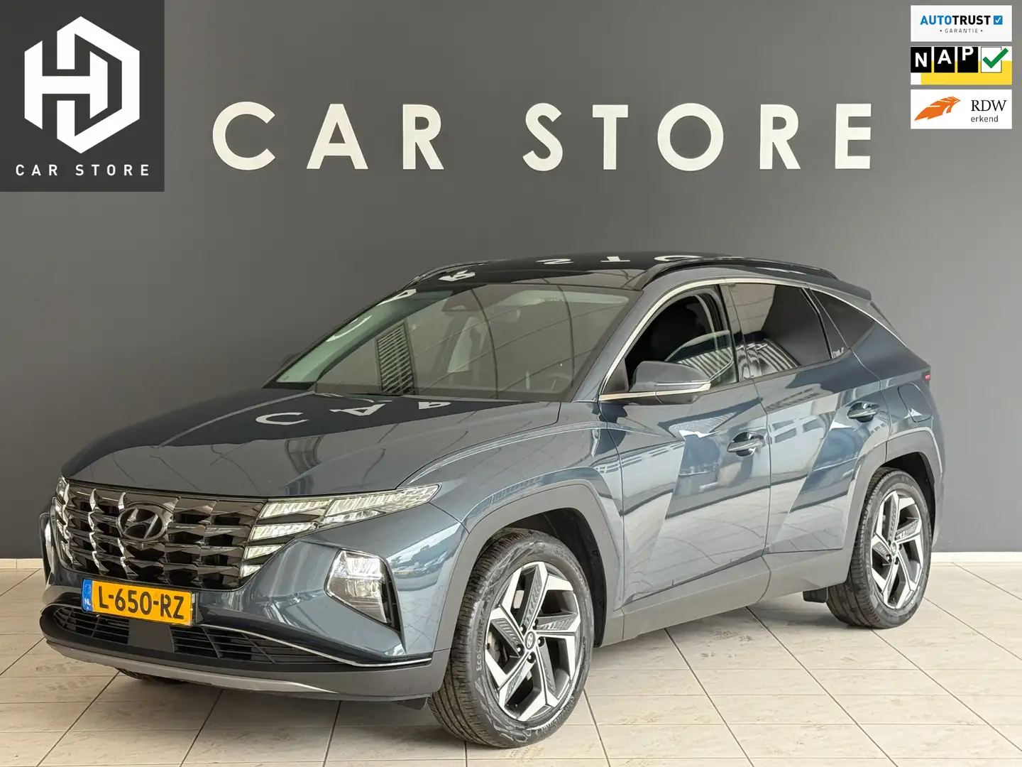 Hyundai TUCSON 1.6 T-GDI PHEV Premium Sky 4WD Pano|Memory|Leder|K Blauw - 1