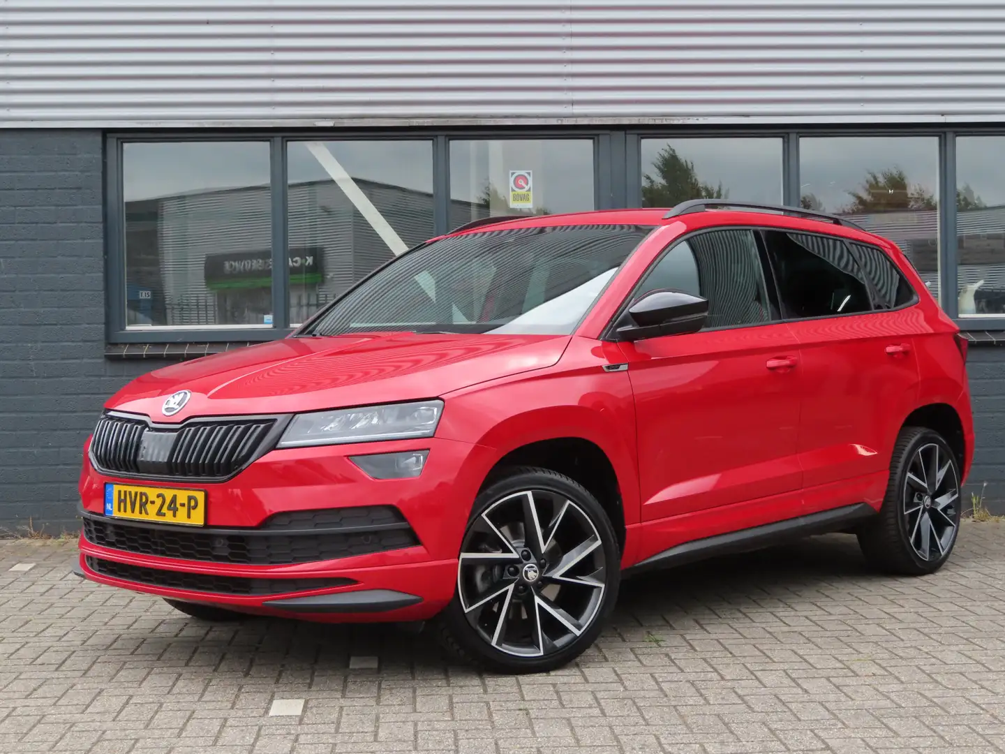 Skoda Karoq 1.5 TSI ACT Sportline Business DSG | trekhaak | ca Rood - 1