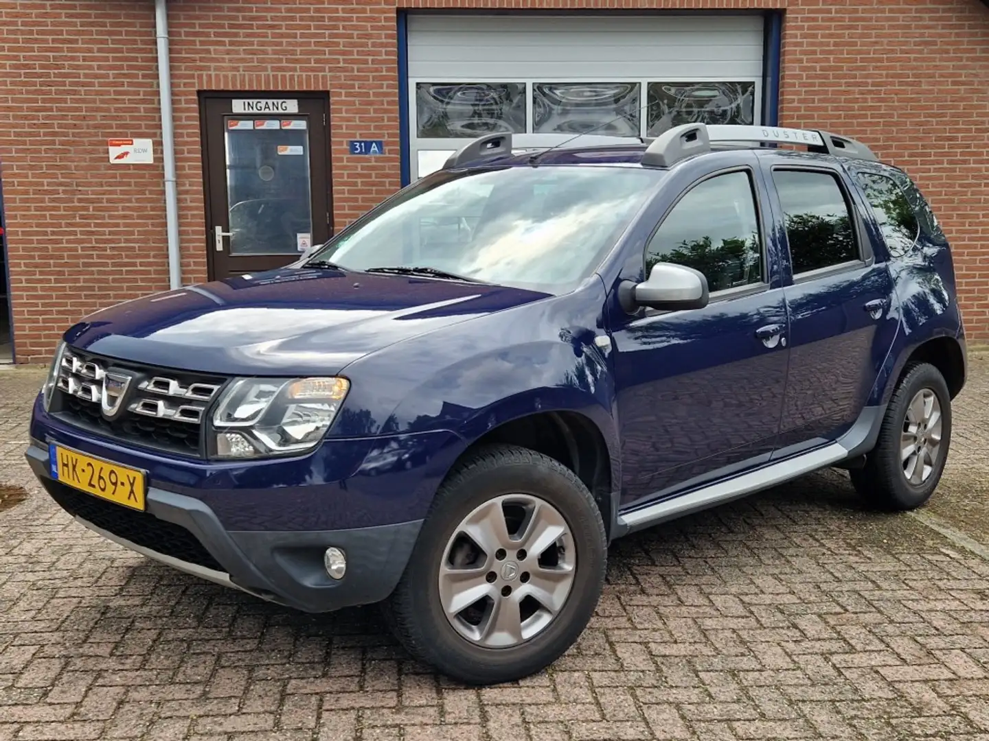 Dacia Duster 1.2 TCe 4x2 Prestige NL-auto Airco Leer Navi Trekh Azul - 1
