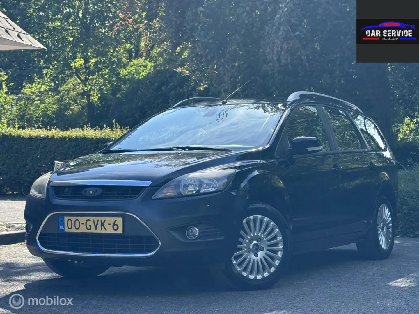 Ford Focus Wagon 1.8 Titanium Flexi Fuel/PDC/LMW/NAVI/NAP Schwarz - 1