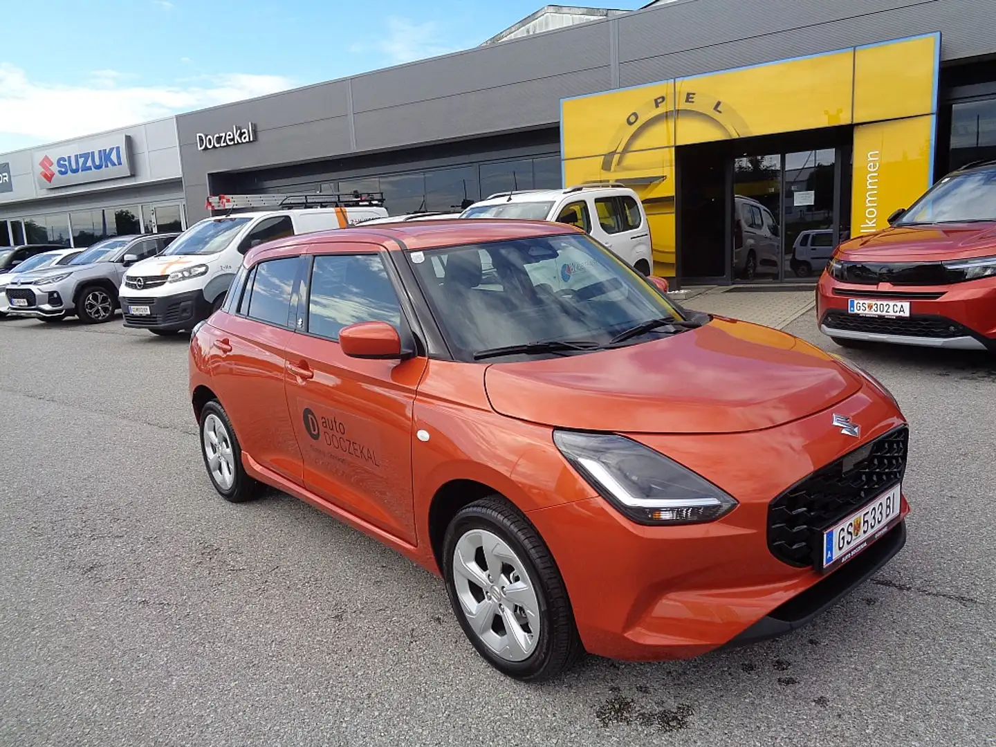Suzuki Swift 1,2 Hybrid Allgrip Shine Orange - 1