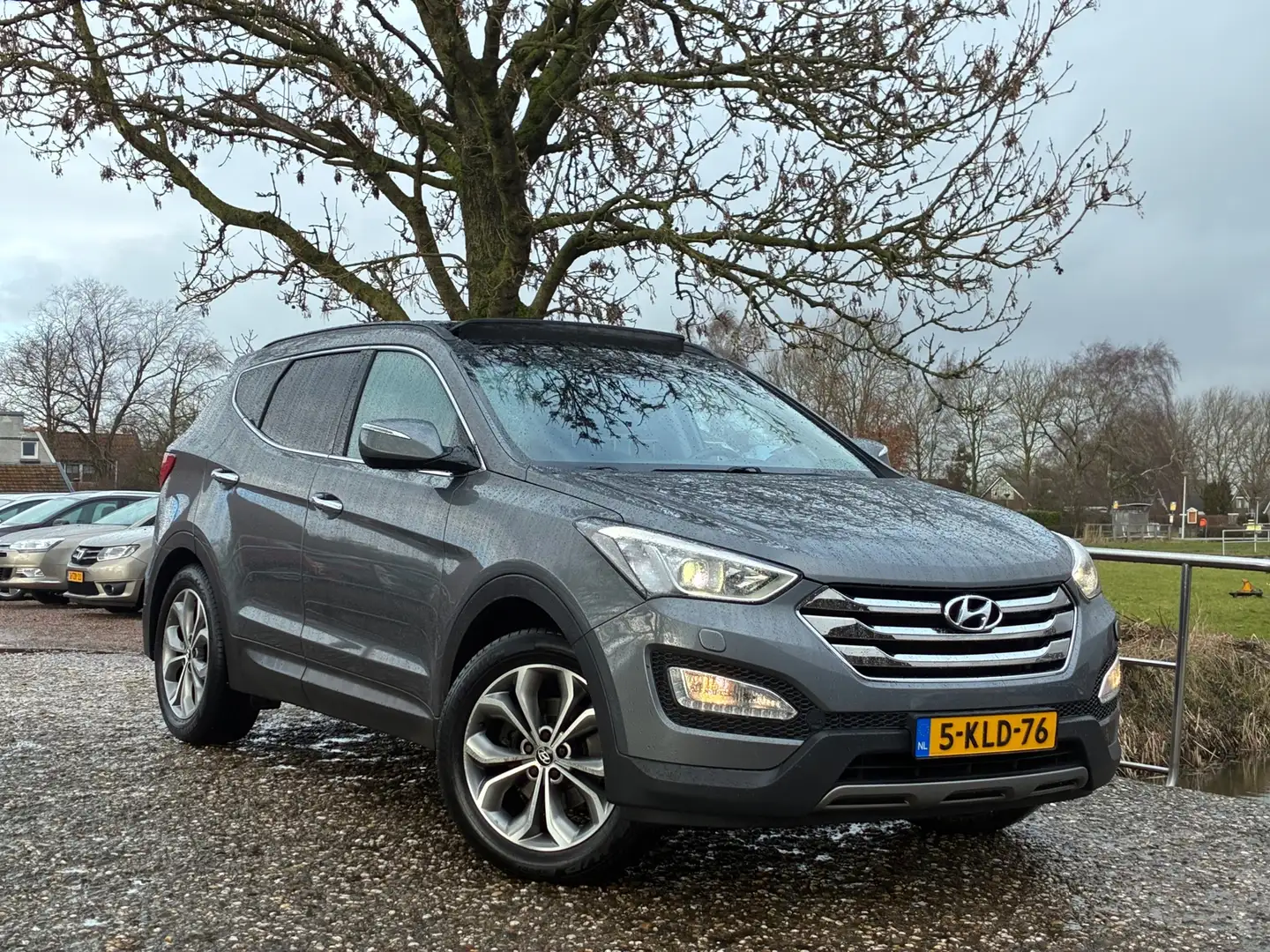 Hyundai SANTA FE 2.4i GDI i-Catcher | Pano + Cruise + Clima Nu € 13 Grau - 1