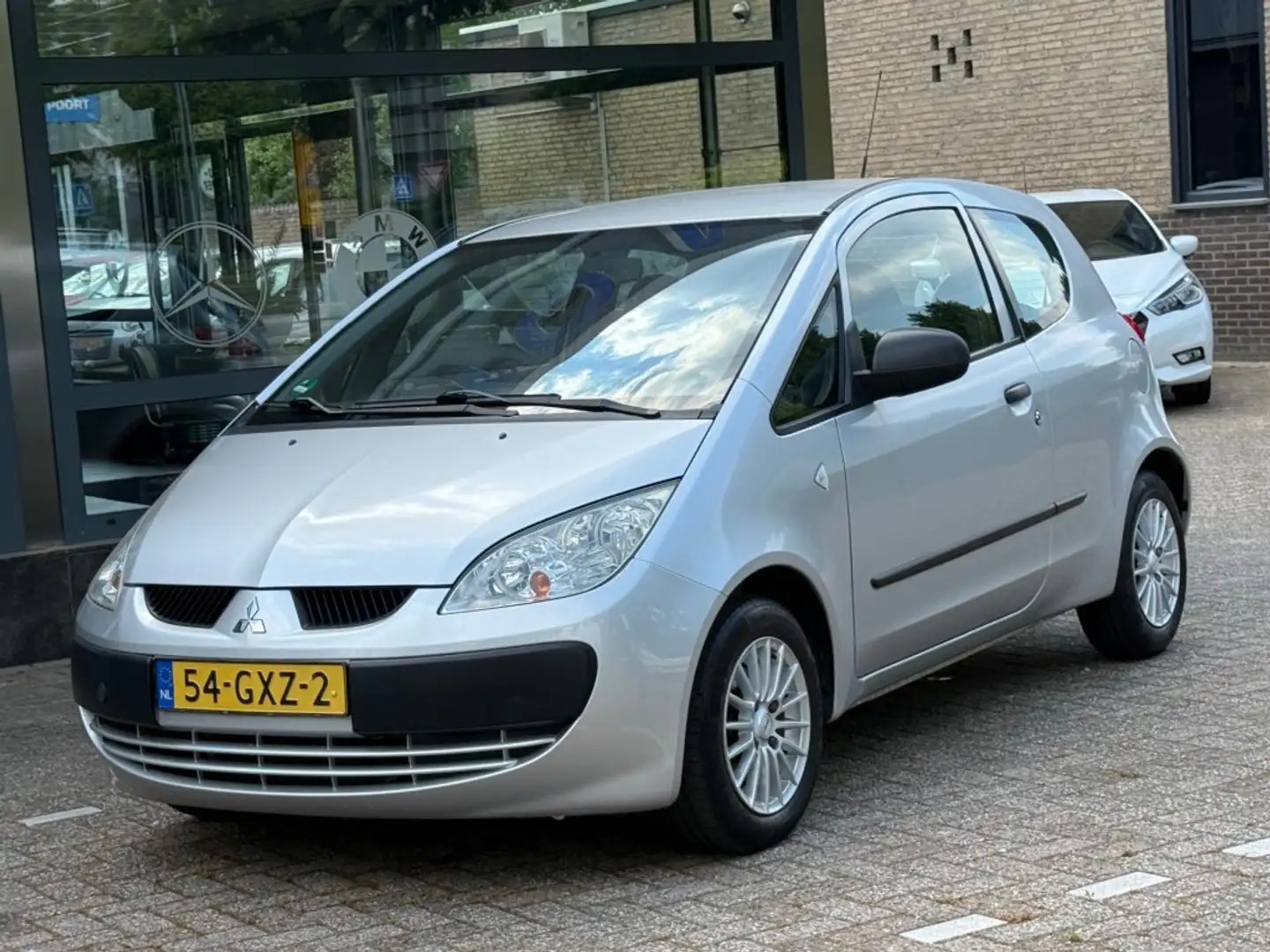 Mitsubishi Colt 1.1 Inform Airco NL-Auto NAP Grijs - 2