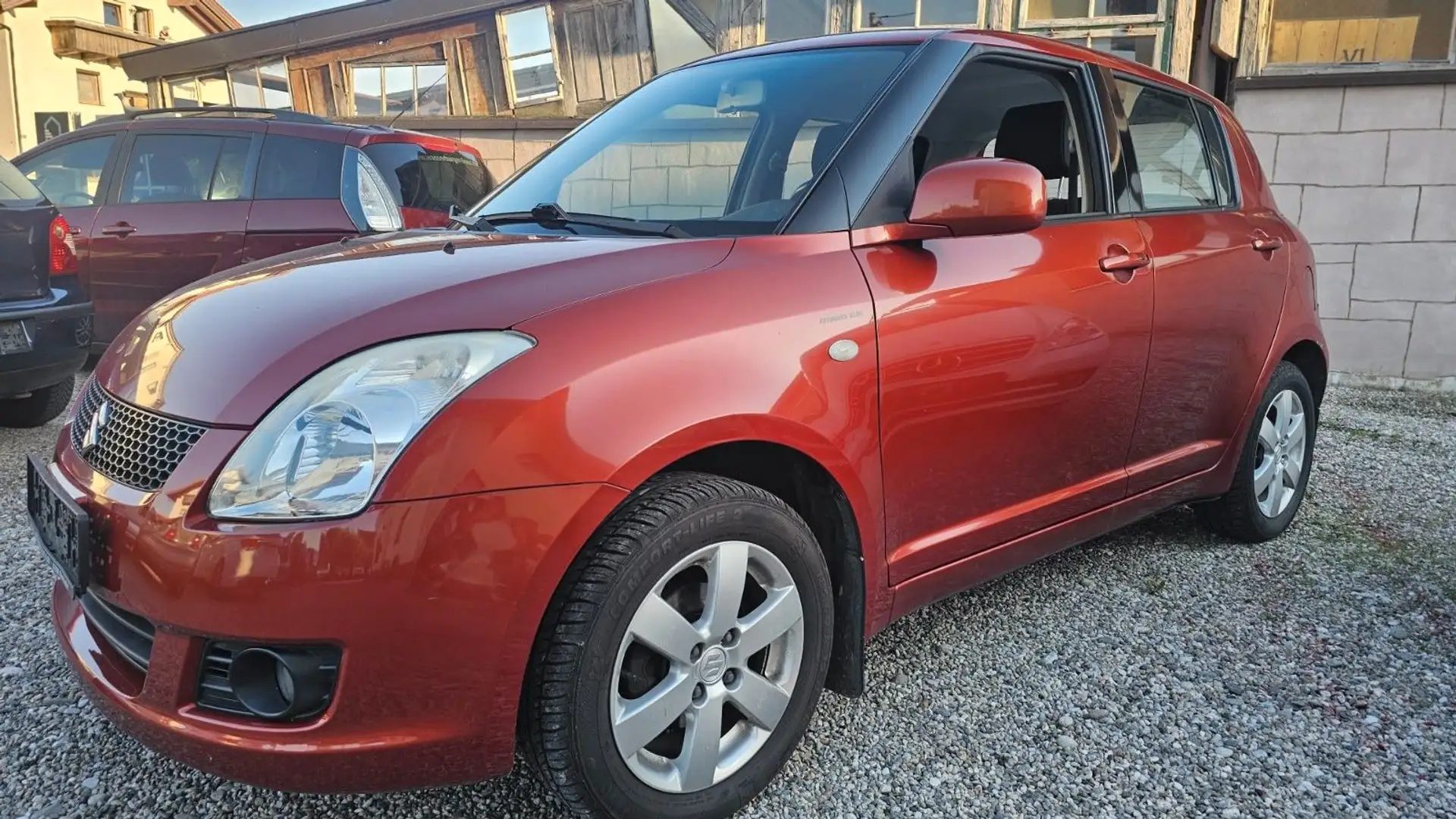 Suzuki Swift Lim. Snow 4x4 Klimaautomatik Rood - 1