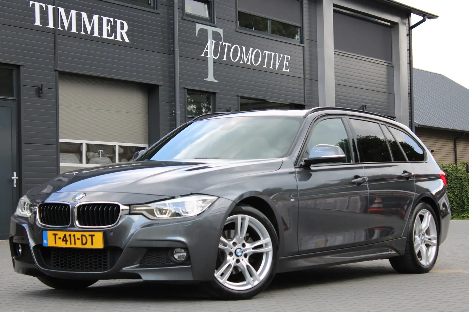 BMW 320 3-serie Touring 320i M-Sport - Dealer onderhouden Grijs - 1