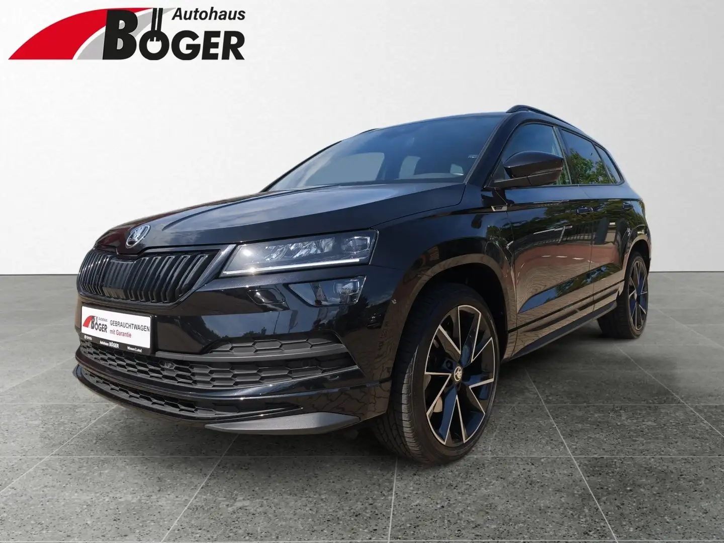 Skoda Karoq 2.0 TSI DSG 4x4 Sportline *PANO*AHK Schwarz - 1