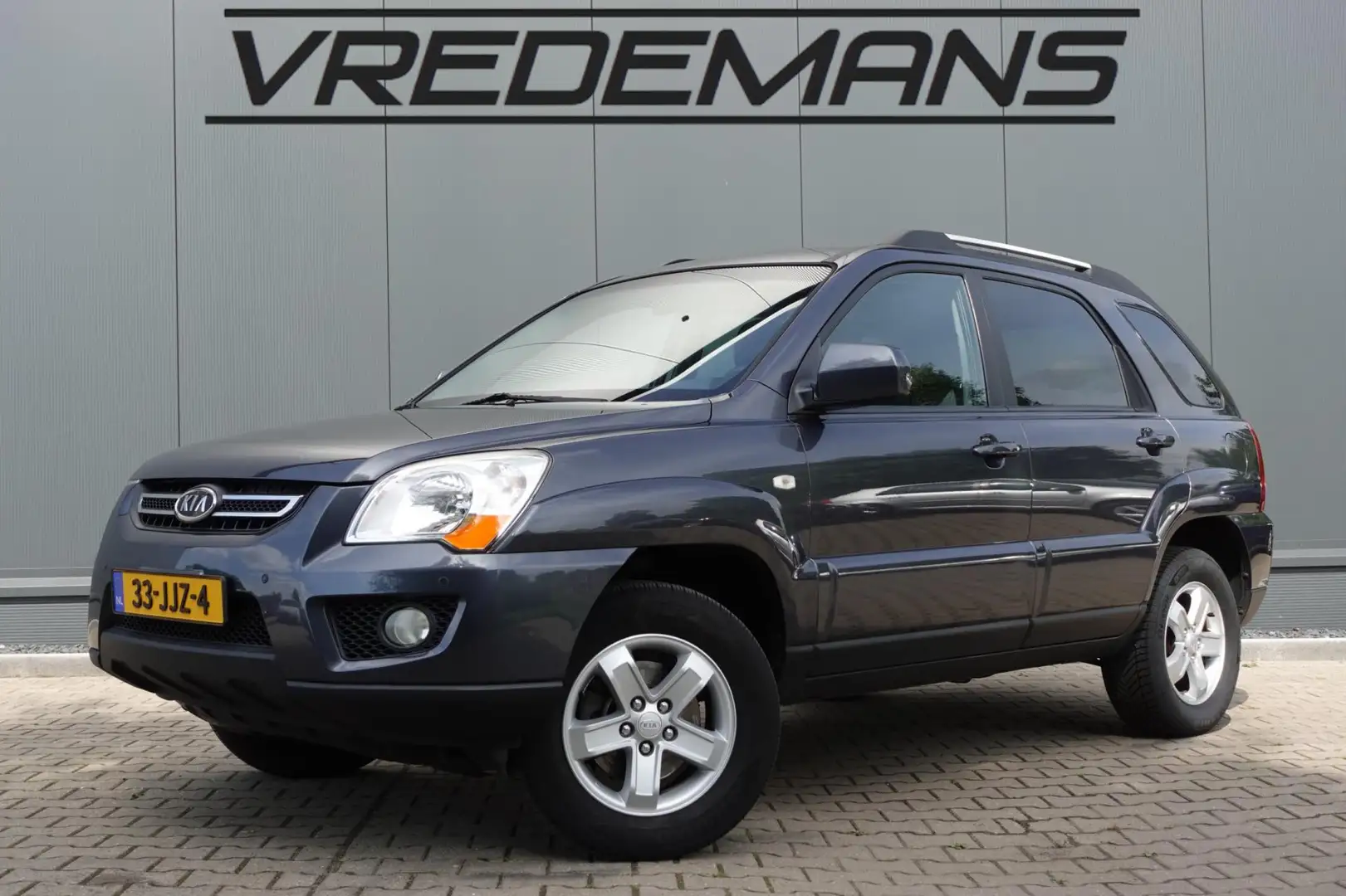 Kia Sportage 2.0 CVVT X-tra Gris - 1