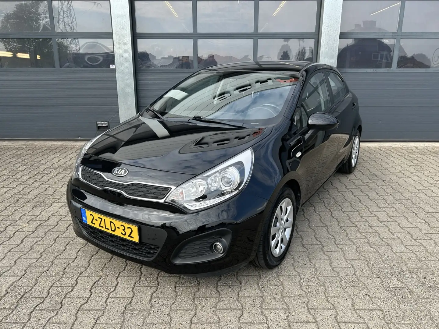 Kia Rio 1.2 CVVT 85pk 5-drs BusinessLine Zwart - 1