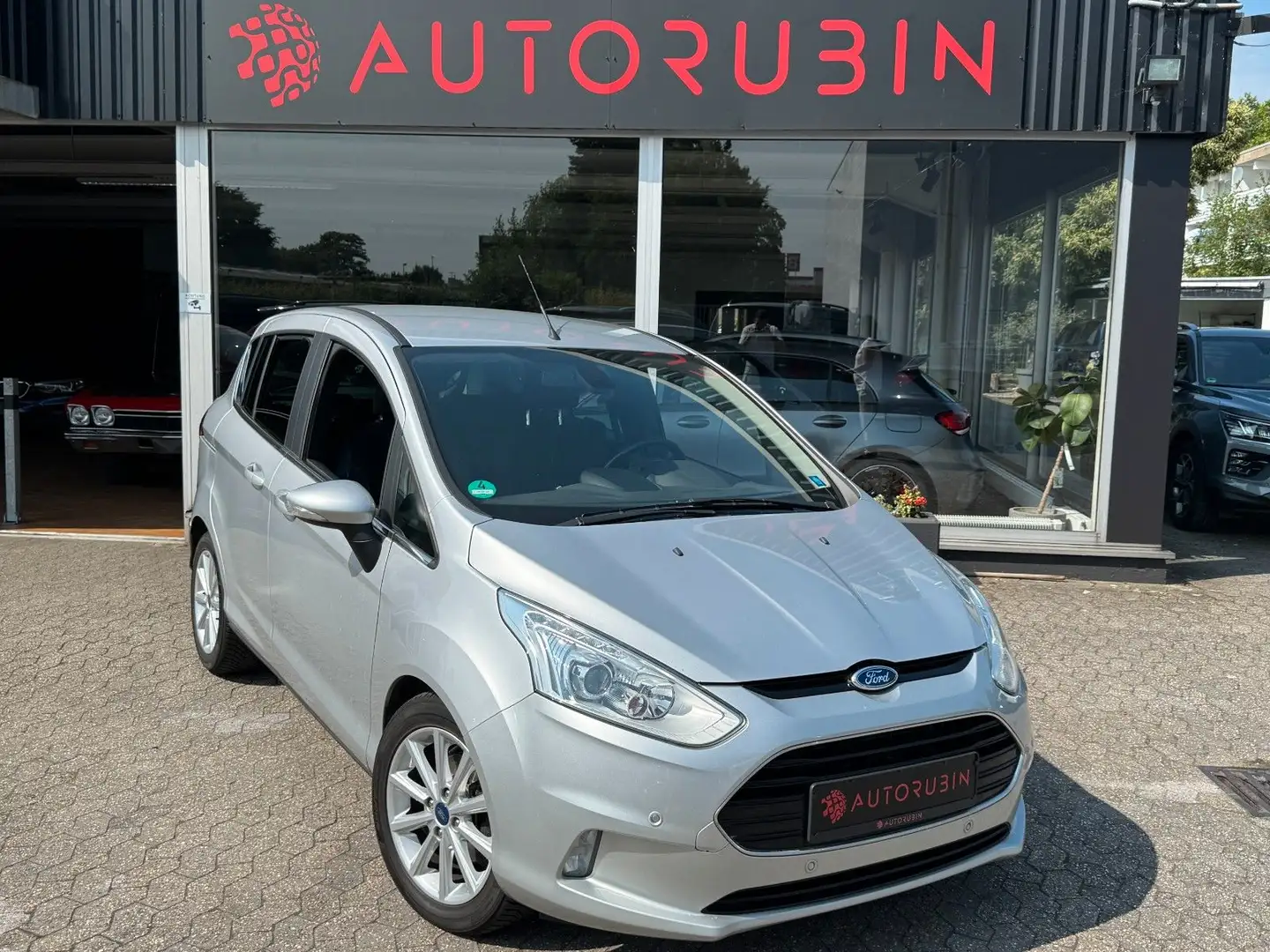 Ford B-Max B-MAX Titanium 1.HAND/PDC/TEMPO/KLIMA/SHZ Silber - 1