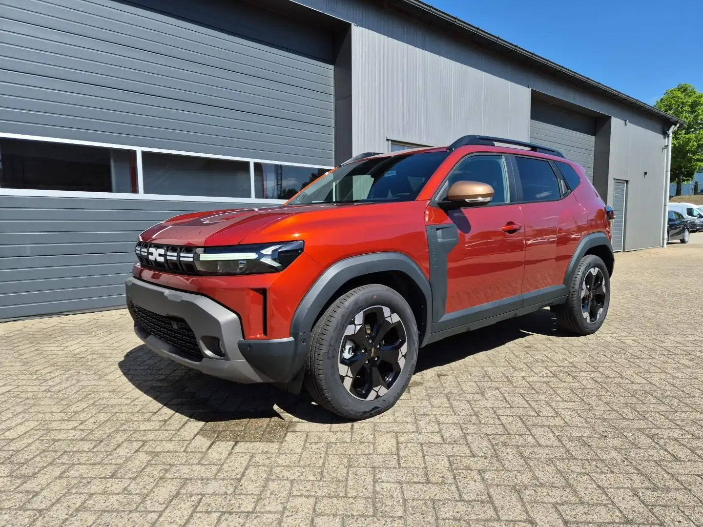 Dacia Duster Extreme Hybrid 140PS Automatik 1.6 SCE Lenkradh... Braun - 1