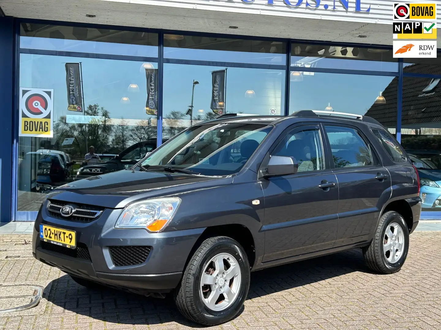 Kia Sportage 2.0 CVVT X-Pect Airco LM-Velgen Elek.Pakket Trekha Grijs - 1