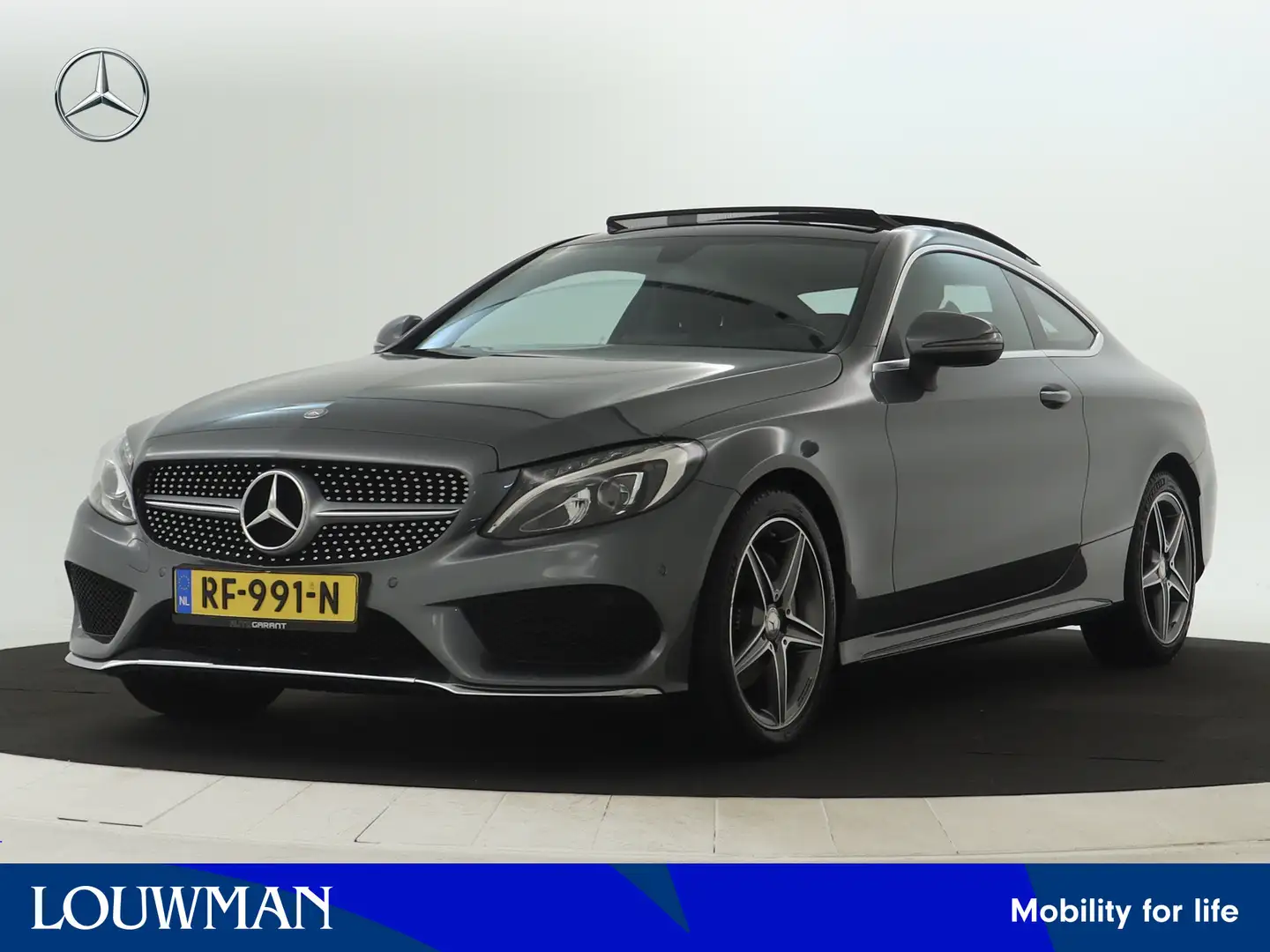 Mercedes-Benz C 180 AMG Sportpakket | Panoramadak | LED Verlichting | Grijs - 1