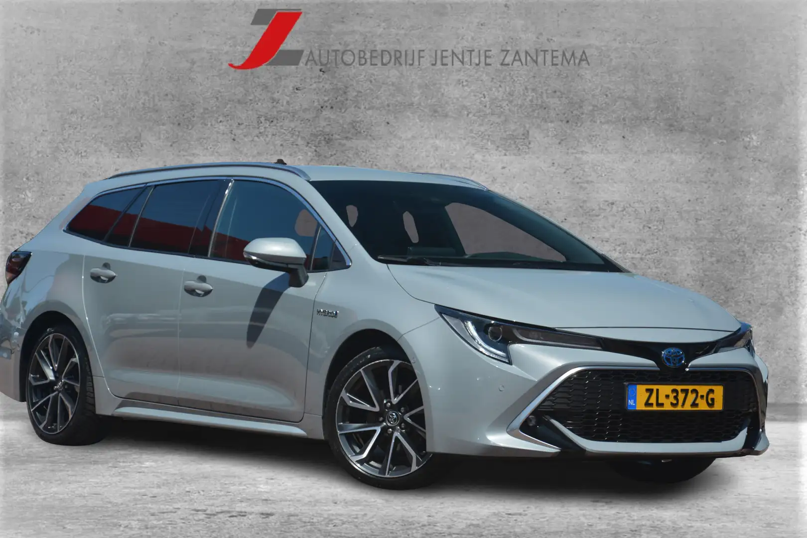 Toyota Corolla Touring Sports 2.0 Hybrid Executive 1e eigenaar Ne Grijs - 1
