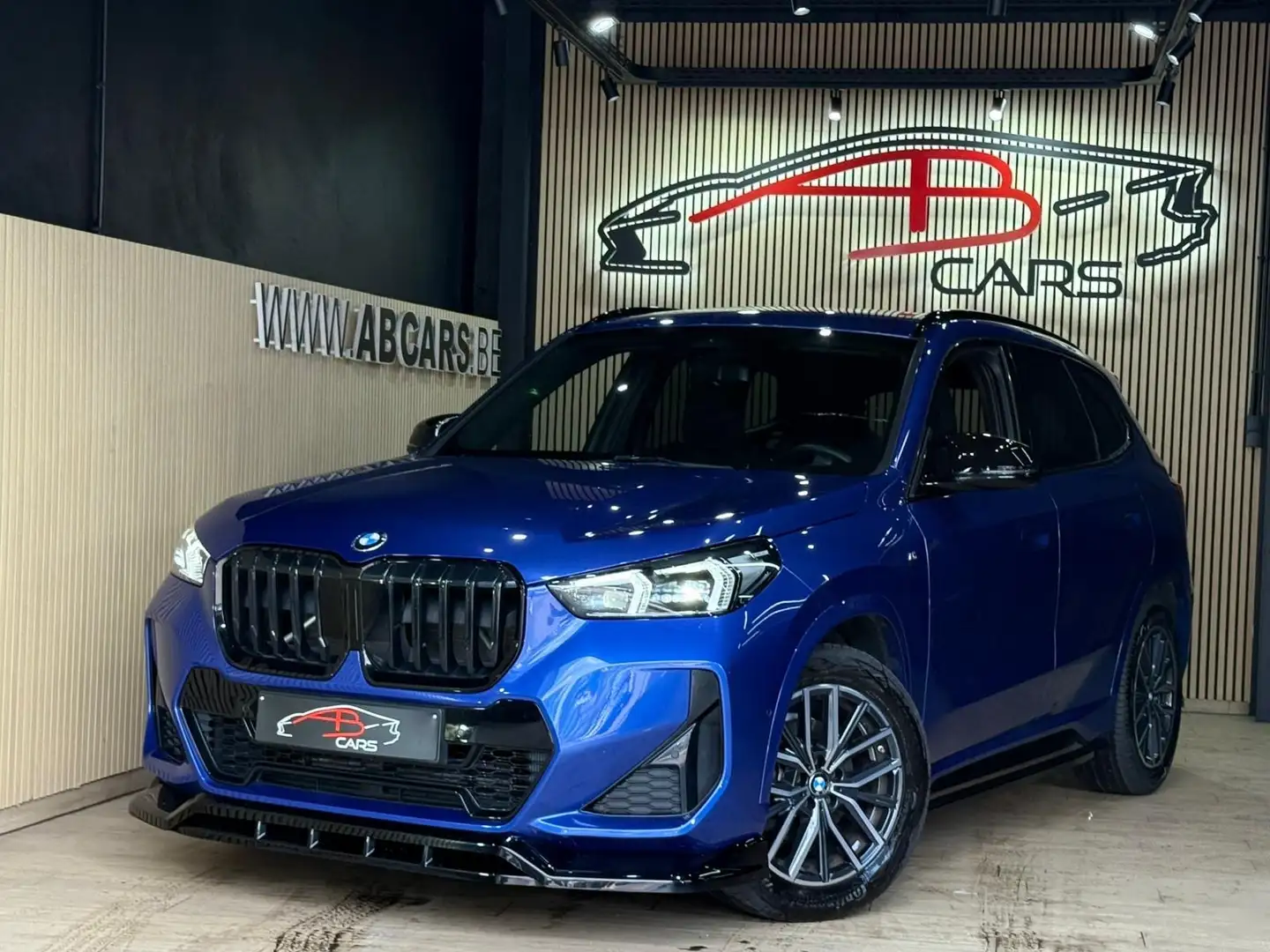 BMW X1 1.5iAS sDrive20 MHEV * PACK M PERFORMANCE * Blauw - 1