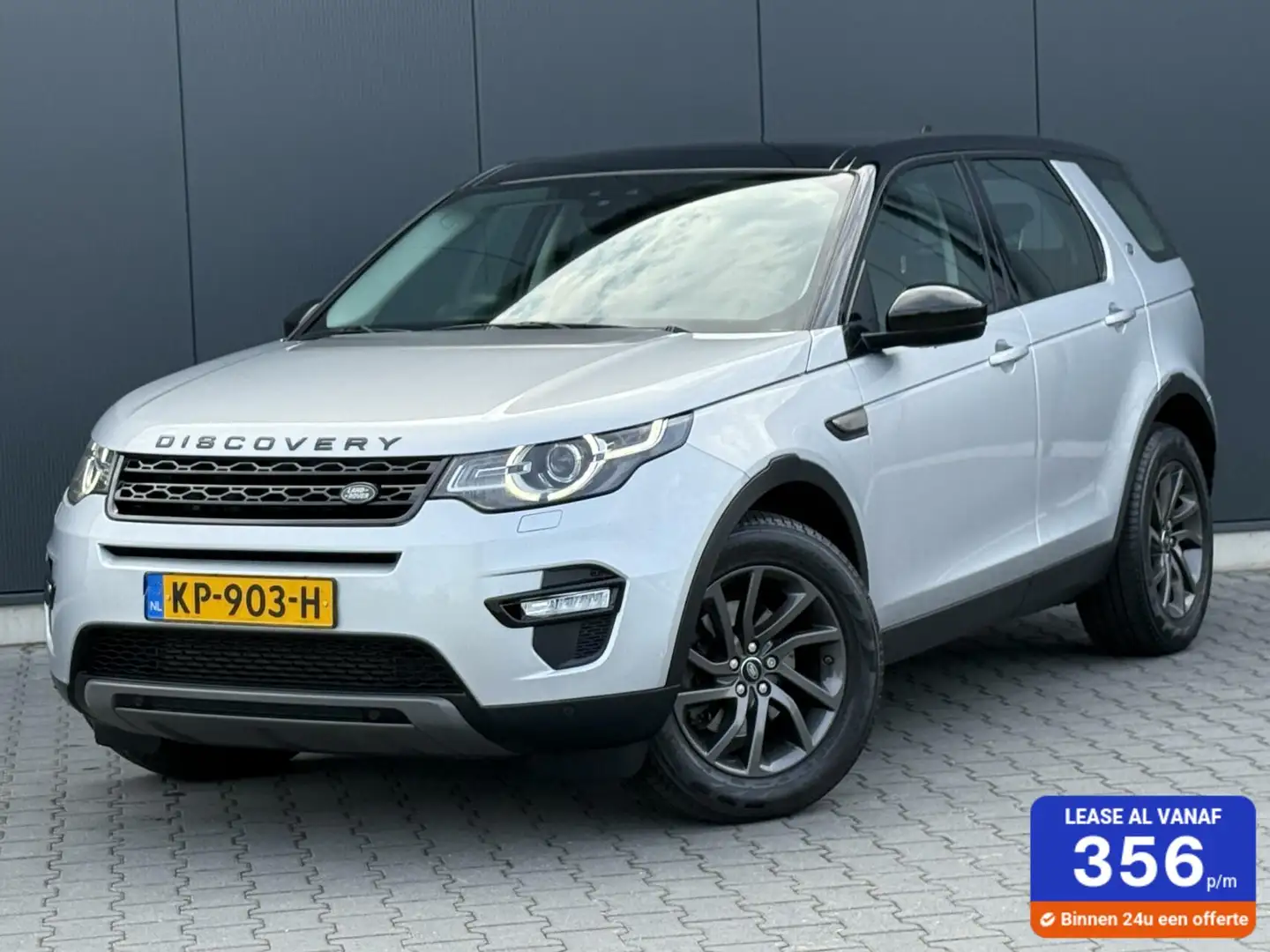 Land Rover Discovery Sport 2.0 Si4 4WD HSE Panoramdak - Leder - Keurige Auto Grijs - 1