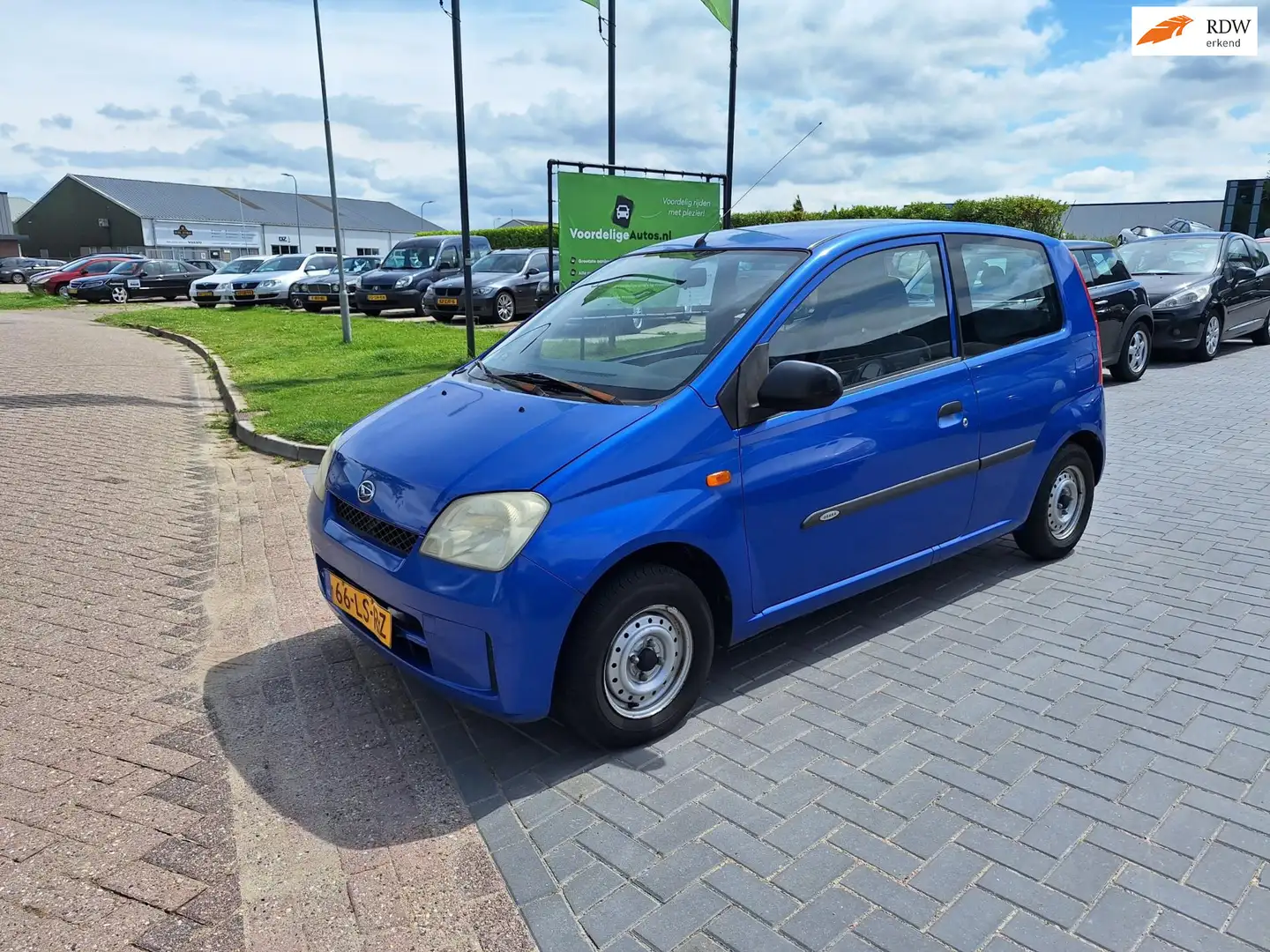 Daihatsu Cuore 1.0-12V Osaka / 56.431 km NAP / APK juni 2026 Blauw - 1