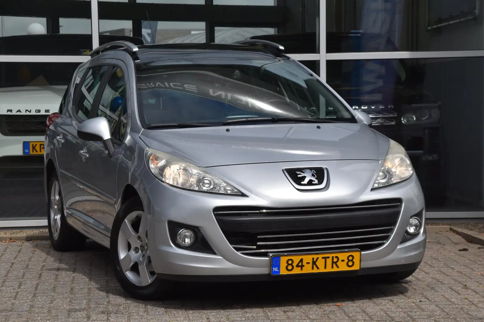 Peugeot 207 SW 1.6 VTi XS Airco Nav. Pano. dak Pdc Trekhaak 1s Grijs - 1