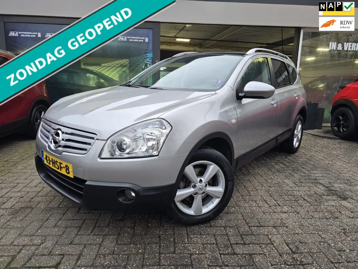 Nissan Qashqai+2 2.0 Tekna | 2E EIGENAAR | 12MND GARANTIE | PANO DA Grey - 1