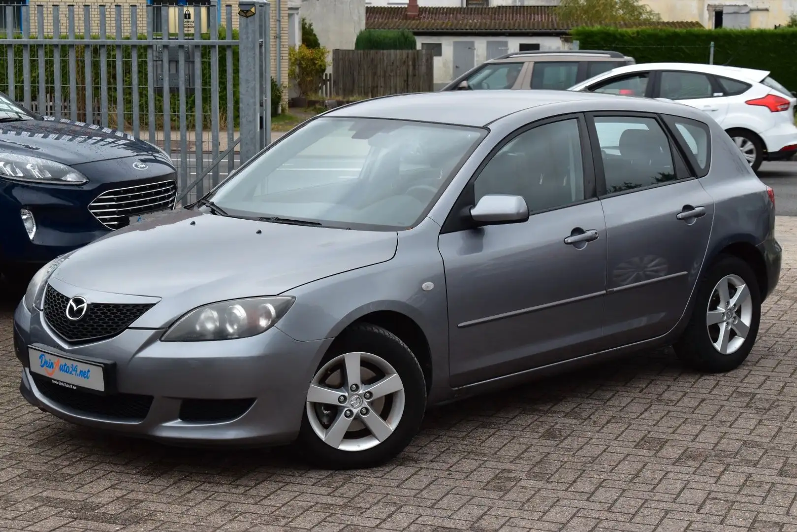 Mazda 3 Lim. 1.6 Sport Comfort Aut.|Navi|Klimaaut.|El. Grau - 1