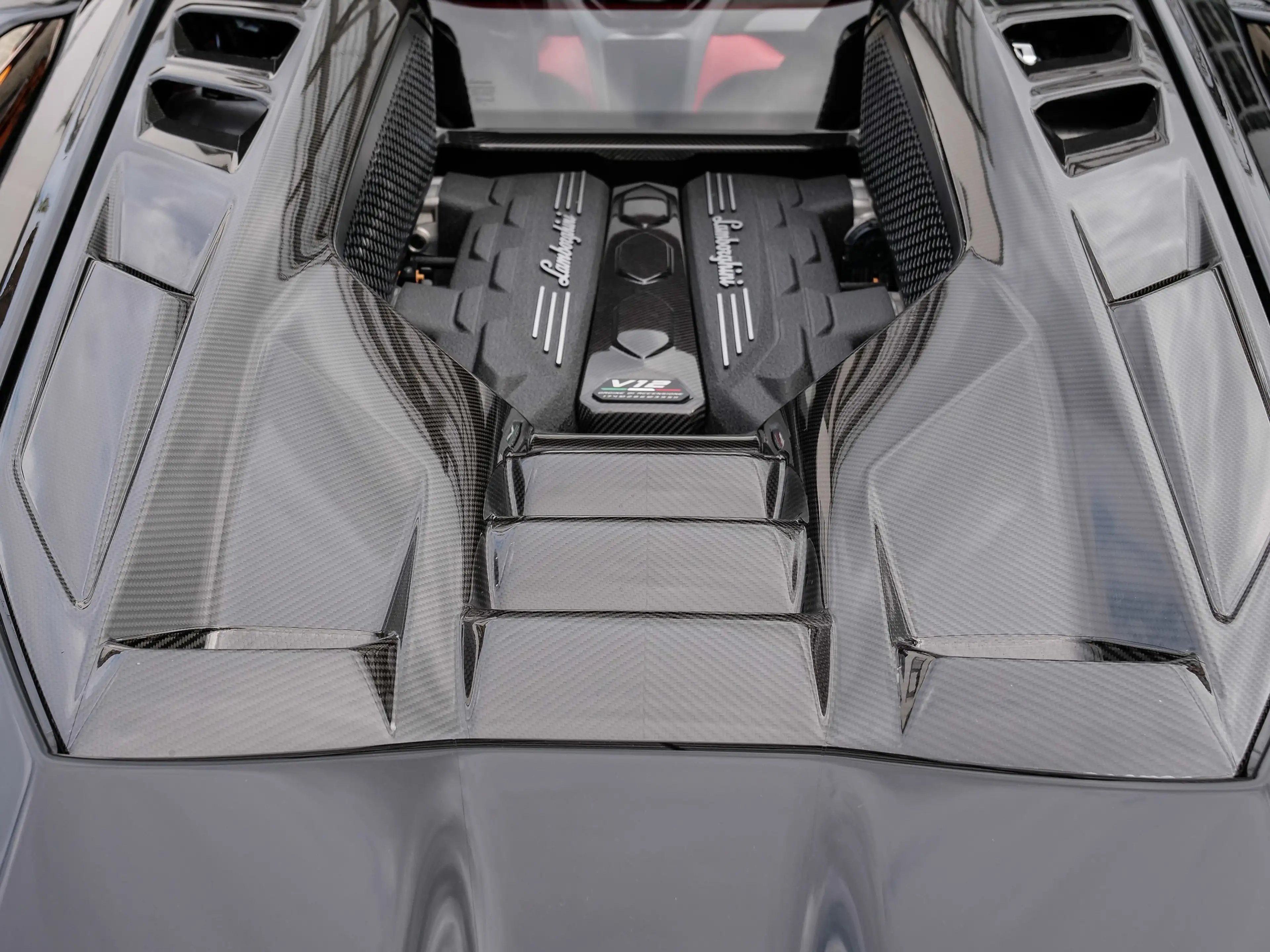 Lamborghini Revuelto Fading Rosso Bia to Nero Granatus — photo 11
