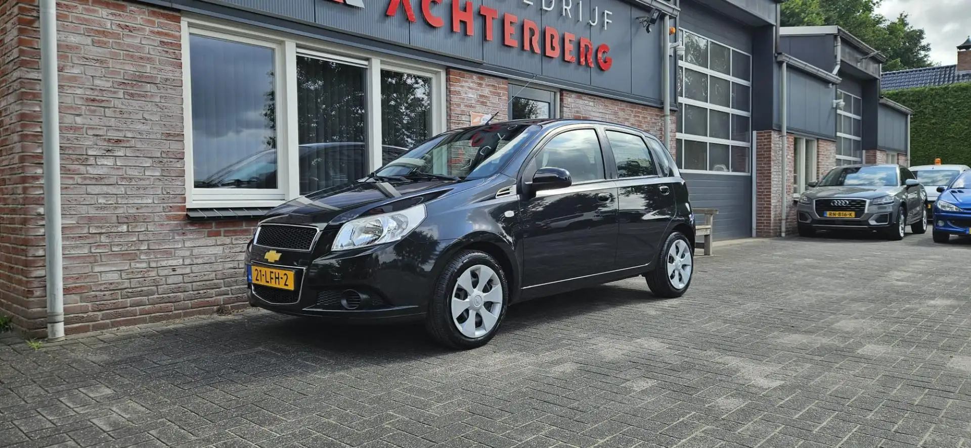 Chevrolet Aveo 1.2 16V LS B-clever Trekhaak! NAP! Airco! 5-Deurs! Black - 1