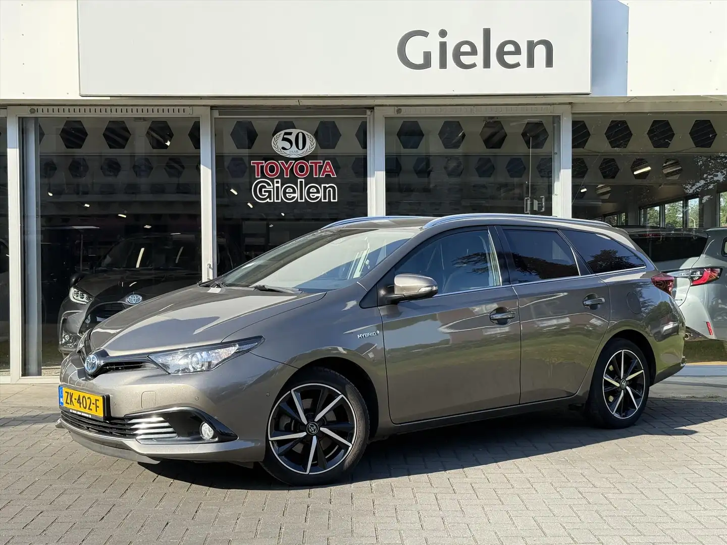 Toyota Auris Touring Sports 1.8 Hybrid Dynamic Ultimate | Eerst Bruin - 1