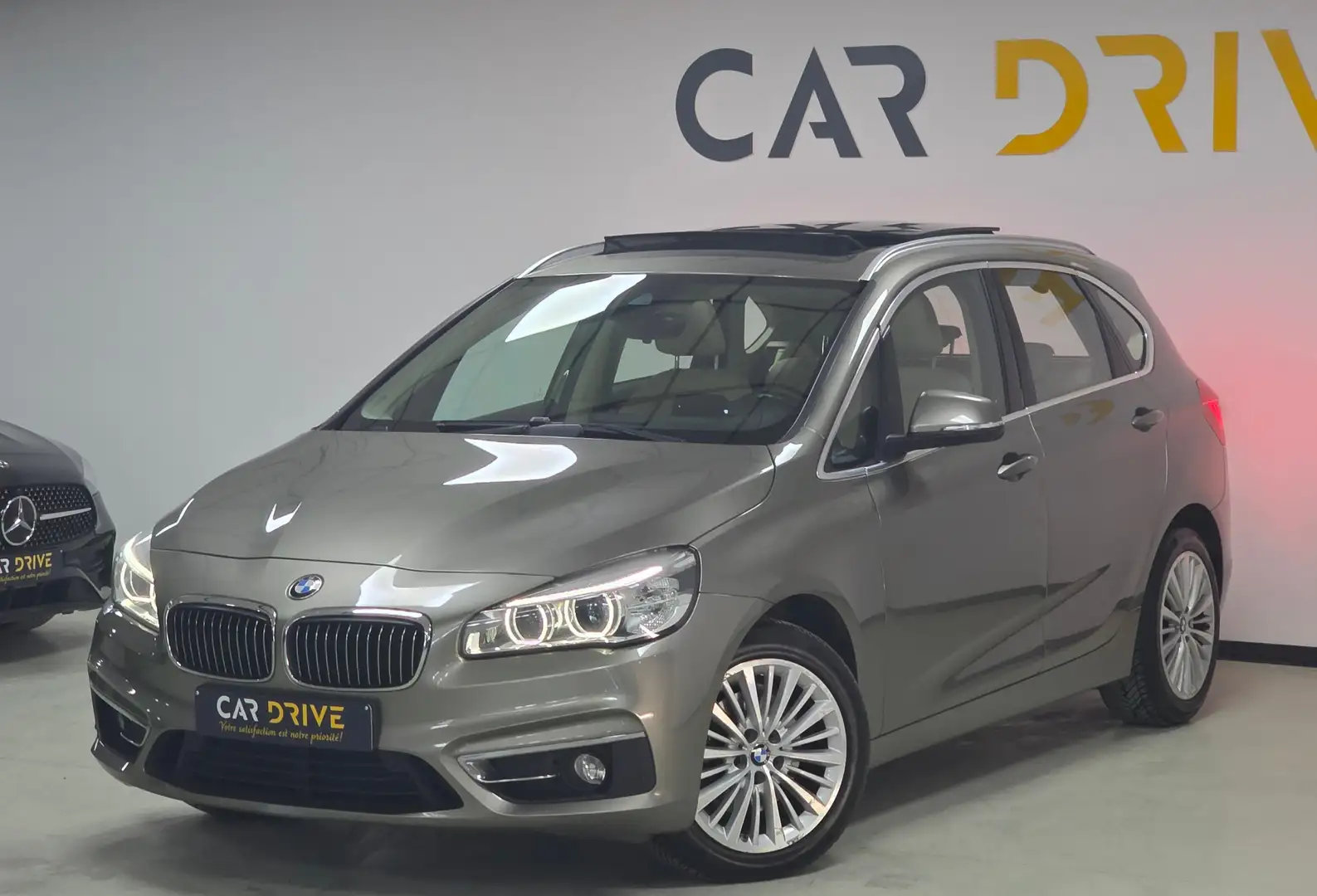 BMW 220 Active Tourer dXAS TOIT PANO/CAPTEURS/CRUISE/LED Grijs - 1
