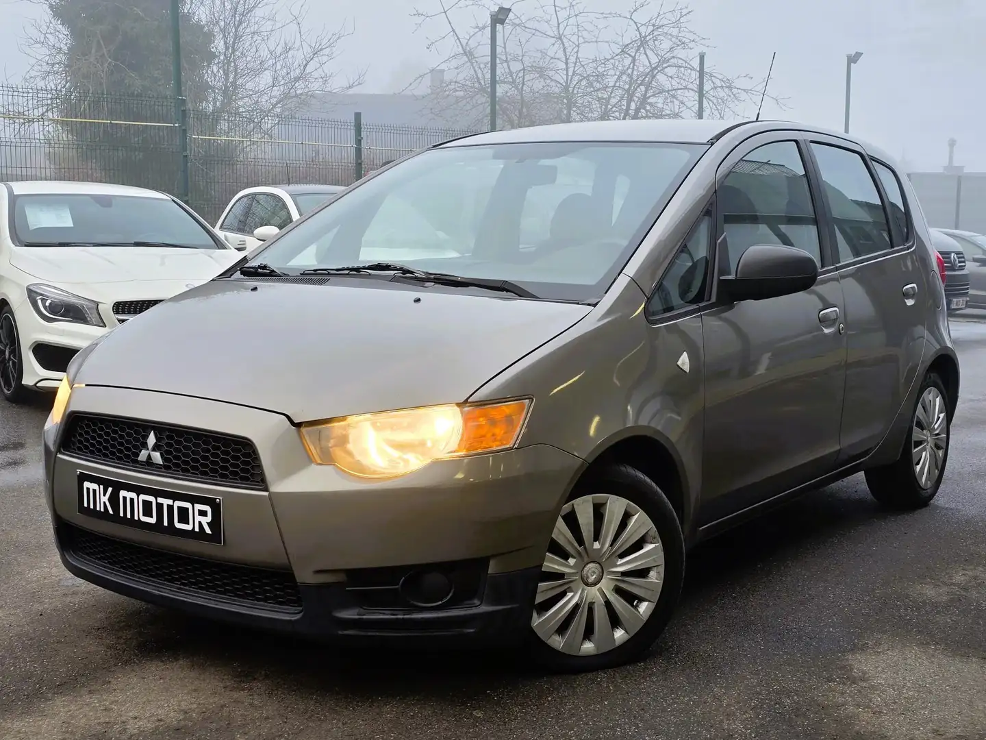 Mitsubishi Colt 🟢1.1 ESSENCE 75CV - AIRCO Brun - 1
