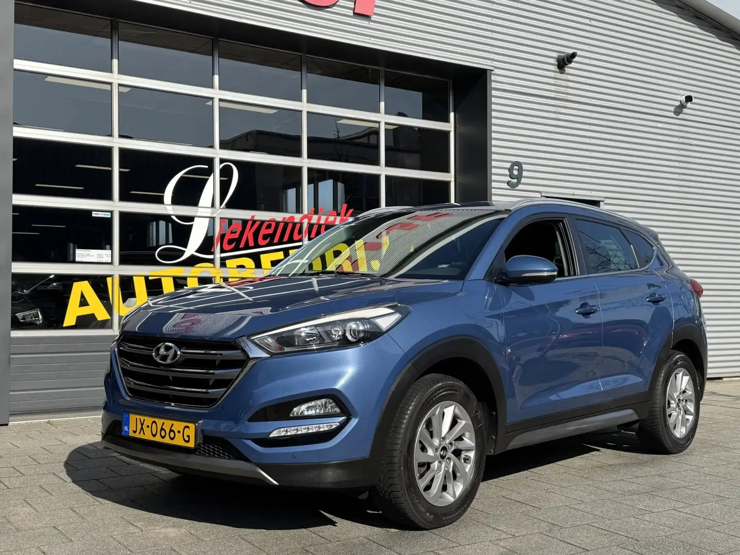 Hyundai TUCSON 1.6 GDi Comfort - Navigatie I Airco I PDC /Xenon I Azul - 1
