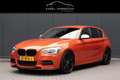 BMW 135 1-serie M135i xDrive High Executive | M-PAKKET | A Orange - thumbnail 1