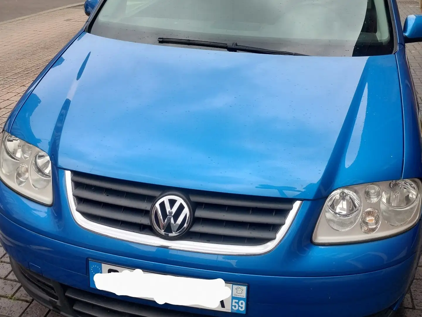Volkswagen Touran TDI 105 Carat 5pl Blauw - 2