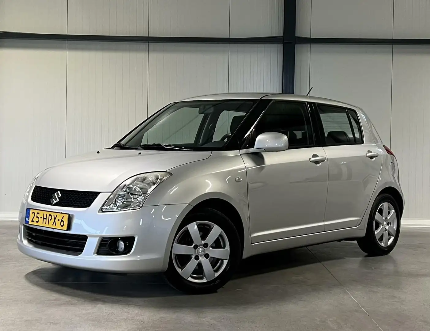 Suzuki Swift 1.3 Shogun Airco Radio 1e Eig Dealeronderhouden Gris - 1