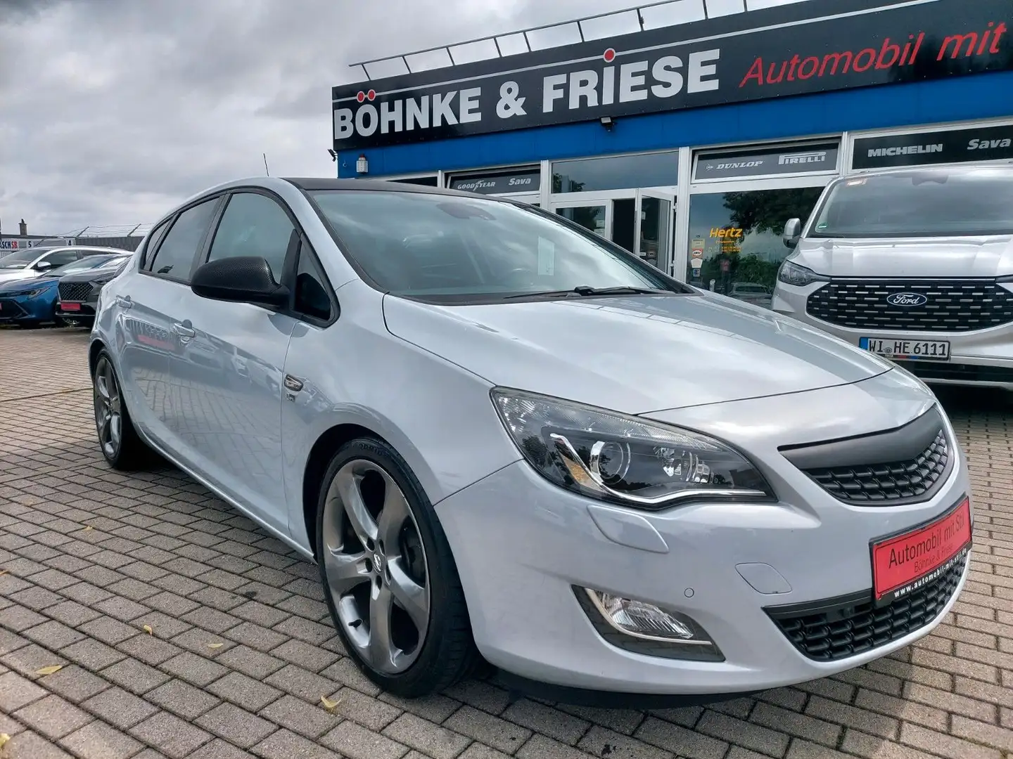 Opel Astra J Lim. 5-trg. 150 Jahre Opel Xenon Leder Gris - 1