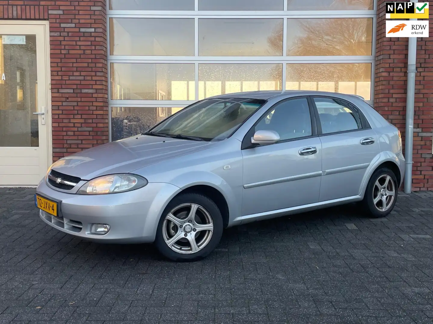 Chevrolet Lacetti 1.6-16V Style | APK 14-10-2026 | Airco | 5 Deurs | Gris - 1