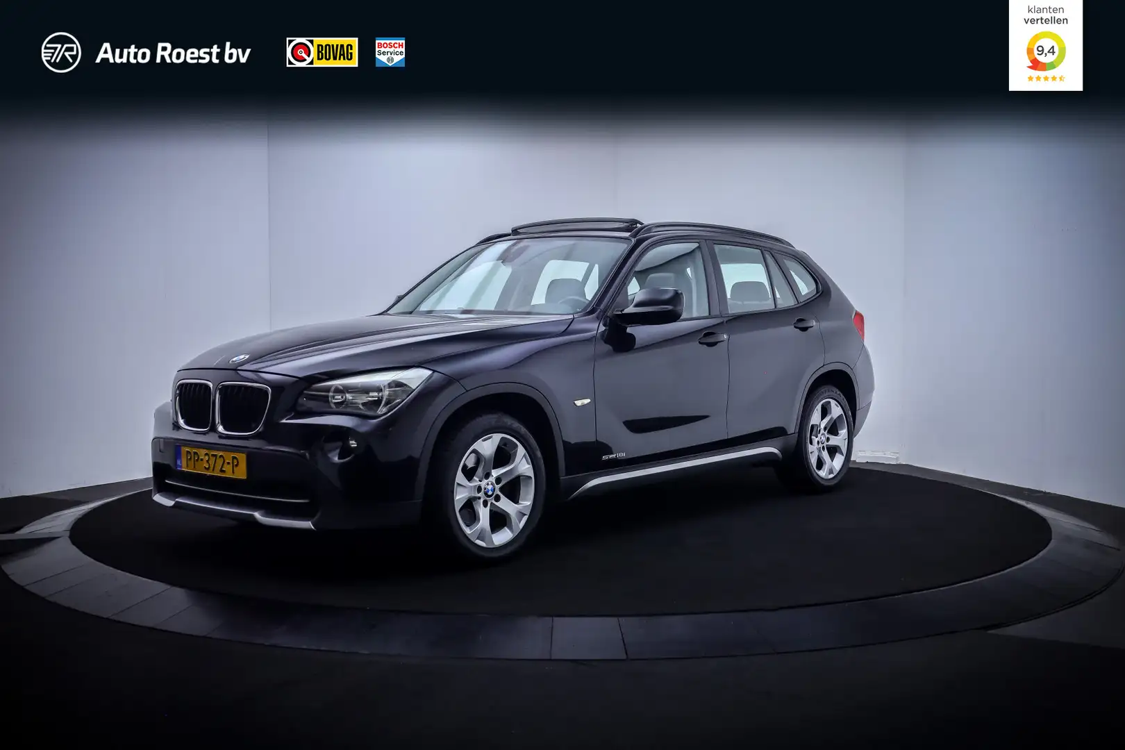 BMW X1 18i Executive PANO | LEDER | STOELVERW | NAVI | CL Zwart - 1