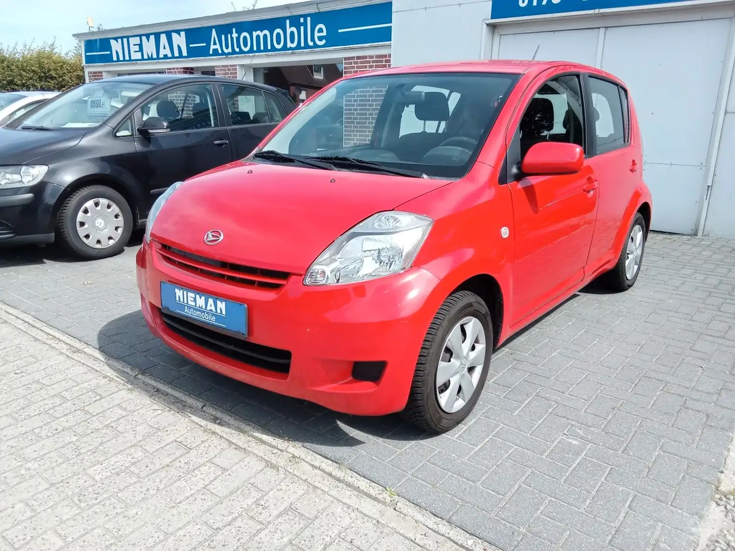 Daihatsu Sirion 1.0 CooLine,TÜV NEU,1 JAHR GEWÄHRLEISTUNG Rouge - 1