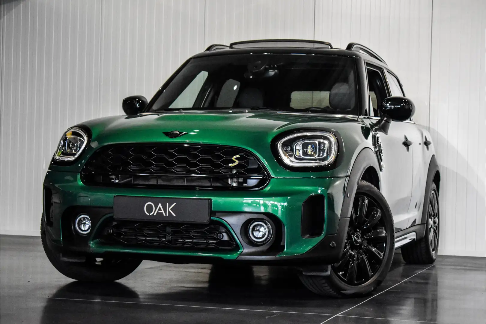 MINI Cooper SE Countryman Hybrid ALL4 Aut. | Navigatie | Panorama | Half Led Verde - 1